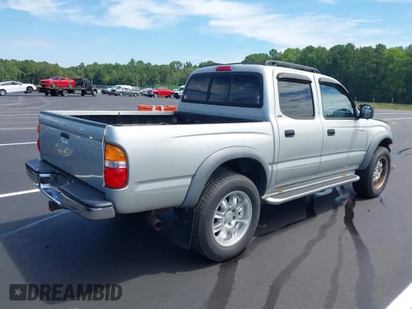 ✅ 2003 Toyota Tacoma PreRunner • VIN: 5TEGN92N93Z202918 • Lot: 42874608. Listed on IAAI with 209,526 mi. Free auction sales archive from the USA and detailed vehicle history report at DreamBid. Image 4.