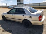 ✅ 2003 Mazda Protege DX • VIN: JM1BJ226730103729 • Lot: 63227285. Listed on Copart with 185,866 mi. Free auction sales archive from the USA and detailed vehicle history report at DreamBid. Image 2.