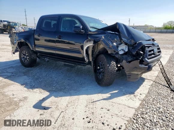 ✅ 2023 Toyota Tacoma SR5 • VIN: 3TMAZ5CN0PM219028 • Lot: 52050355. Listed on Copart with 31,371 mi. Free auction sales archive from the USA and detailed vehicle history report at DreamBid. Image 4.