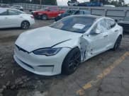 ✅ 2023 Tesla Model S Plaid • VIN: 5YJSA1E63PF521945 • Lot: 43248046. Listed on IAAI with 26,327 mi. Free auction sales archive from the USA and detailed vehicle history report at DreamBid. Image 6.