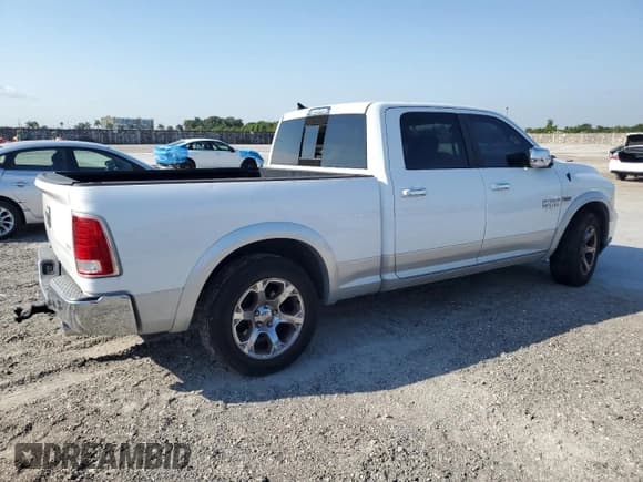 ✅ 2015 Ram 1500 Laramie • VIN: 1C6RR6VT9FS523511 • Lot: 48937365. Listed on Copart with 157,633 mi. Free auction sales archive from the USA and detailed vehicle history report at DreamBid. Image 3.