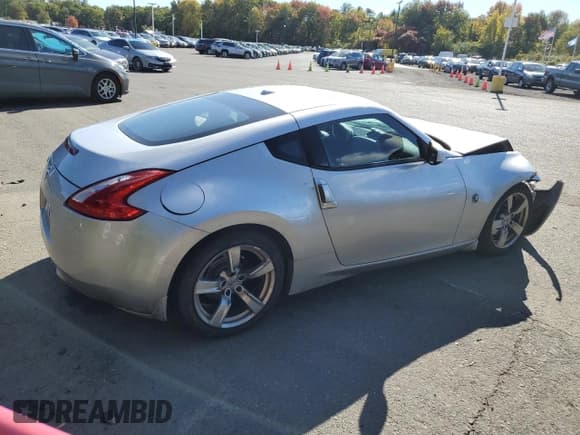 ✅ 2009 Nissan 370Z Touring • VIN: JN1AZ44E69M407031 • Лот: 75331544. Опубликован ранее на Copart с пробегом 171 288 миль. Бесплатный доступ к архиву аукционных продаж из США и подробный отчёт об истории автомобиля на DreamBid. Изображение 3.