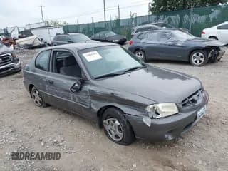 ✅ 2001 Hyundai Accent GS • VIN: KMHCG35CX1U084668 • Лот: 42901263. Опубликован ранее на IAAI с пробегом 129 889 миль. Бесплатный доступ к архиву аукционных продаж из США и подробный отчёт об истории автомобиля на DreamBid. Изображение 1.