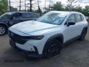 ✅ 2025 Mazda CX-50 S Premium • VIN: 7MMVABDM1SN331834 • Lot: 42412444. Listed on IAAI with 1,975 mi. Free auction sales archive from the USA and detailed vehicle history report at DreamBid. Image 2.