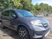 ✅ 2019 Honda Pilot Touring 8-Passenger • VIN: 5FNYF5H95KB010979 • Lot: 43285702. Listed on IAAI with 147,812 mi. Free auction sales archive from the USA and detailed vehicle history report at DreamBid. Image 13.