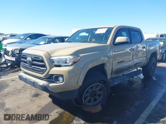 ✅ 2018 Toyota Tacoma TRD Sport • VIN: 3TMAZ5CN5JM078027 • Lot: 43481930. Listed on IAAI with 80,306 mi. Free auction sales archive from the USA and detailed vehicle history report at DreamBid. Image 2.