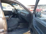 ✅ 2004 Jeep Grand Cherokee Laredo • VIN: 1J4GW48S34C342163 • Lot: 43636001. Listed on IAAI with 306,974 mi. Free auction sales archive from the USA and detailed vehicle history report at DreamBid. Image 5.