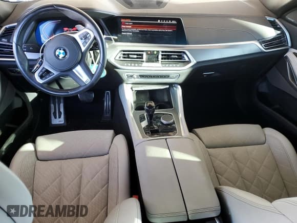 ✅ 2023 BMW X6 xDrive40i • VIN: 5UXCY6C07P9R94803 • Лот: 82569115. Опубликован ранее на Copart с пробегом 28 206 миль. Бесплатный доступ к архиву аукционных продаж из США и подробный отчёт об истории автомобиля на DreamBid. Изображение 8.