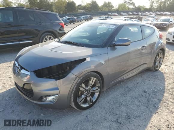 2015 Hyundai Veloster z VIN KMHTC6AD0FU221104, wystawiony jako Copart lot #75229514 z przebiegiem 136 469 mil mil oraz Czysty tytuł • Clean title. Historia ofert i sprzedaży dostępna na DreamBid. Obrazek 1.