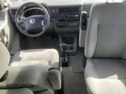 ✅ 2003 Volkswagen EuroVan MV • VIN: WV2MB47003H042703 • Лот: 87093944. Опубликован ранее на Copart с пробегом 127 872 миль. Бесплатный доступ к архиву аукционных продаж из США и подробный отчёт об истории автомобиля на DreamBid. Изображение 8.