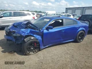 ✅ 2022 Dodge Charger Scat Pack Widebody • VIN: 2C3CDXGJ1NH245647 • Лот: 64944045. Опубликован ранее на Copart с пробегом 8 643 миль. Бесплатный доступ к архиву аукционных продаж из США и подробный отчёт об истории автомобиля на DreamBid. Изображение 1.