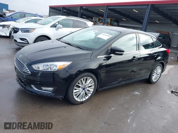 ✅ 2017 Ford Focus Titanium • VIN: 1FADP3J26HL267951 • Lot: 43728220. Listed on IAAI with 84,043 mi. Free auction sales archive from the USA and detailed vehicle history report at DreamBid. Image 2.