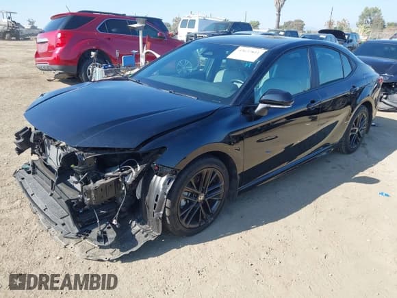 ✅ 2025 Toyota Camry LE • VIN: 4T1DBADK3SU533285 • Лот: 43637811. Опубликован ранее на IAAI с пробегом 13 496 миль. Бесплатный доступ к архиву аукционных продаж из США и подробный отчёт об истории автомобиля на DreamBid. Изображение 2.