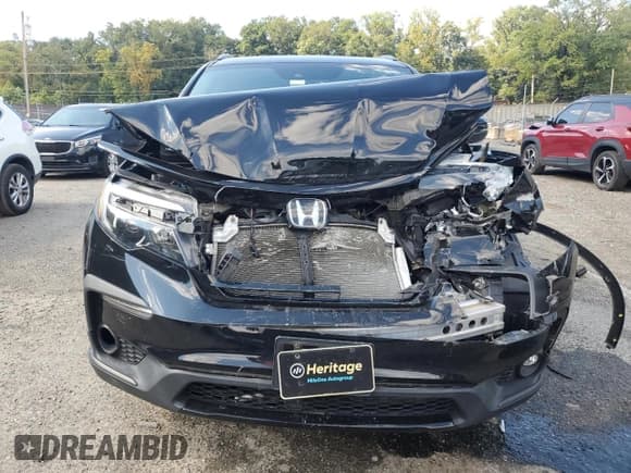 ✅ 2021 Honda Pilot Special Edition • VIN: 5FNYF6H25MB004613 • Lot: 80061955. Listed on Copart with 81,459 mi. Free auction sales archive from the USA and detailed vehicle history report at DreamBid. Image 5.