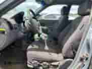 2004 Hyundai Accent GL z VIN KMHCG45C94U574027, wystawiony jako Copart lot #57463905 z przebiegiem 139 595 mil mil oraz Szkoda całkowita • Salvage title. Historia ofert i sprzedaży dostępna na DreamBid. Obrazek 7.