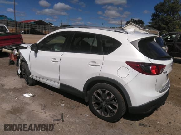 ✅ 2016 Mazda CX-5 Grand Touring • VIN: JM3KE2DY0G0695894 • Lot: 43441374. Wystawiony na IAAI z przebiegiem 112 838 mil. Bezpłatny archiwum sprzedaży aukcyjnych z USA i szczegółowy raport historii pojazdu na DreamBid. Zdjęcie 3.