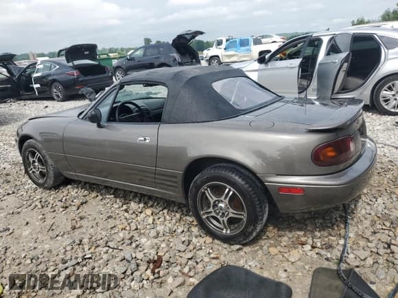 ✅ 1996 Mazda MX-5 Miata • VIN: JM1NA3539T0705116 • Lot: 61926515. Listed on Copart with 87,359 mi. Free auction sales archive from the USA and detailed vehicle history report at DreamBid. Image 2.