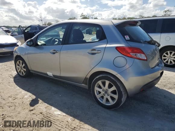 ✅ 2013 Mazda 2 Touring • VIN: JM1DE1LY7D0160988 • Лот: 77275474. Опубликован ранее на Copart с пробегом 106 080 миль. Бесплатный доступ к архиву аукционных продаж из США и подробный отчёт об истории автомобиля на DreamBid. Изображение 2.