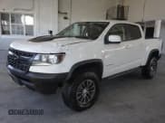 ✅ 2020 Chevrolet Colorado 4WD ZR2 • VIN: 1GCPTEE19L1134962 • Lot: 80129764. Listed on Copart with 143,005 mi. Free auction sales archive from the USA and detailed vehicle history report at DreamBid. Image 2.