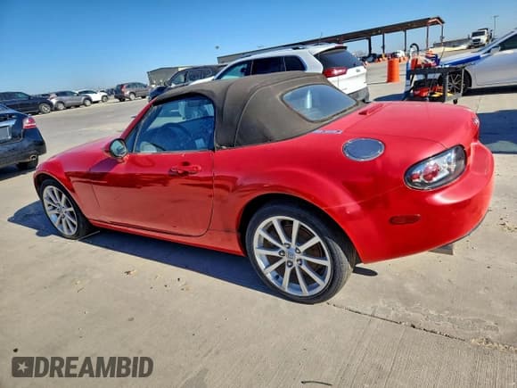 ✅ 2007 Mazda MX-5 Miata Grand Touring • VIN: JM1NC25F470133201 • Lot: 96677615. Listed on Copart with 133,243 mi. Free auction sales archive from the USA and detailed vehicle history report at DreamBid. Image 2.