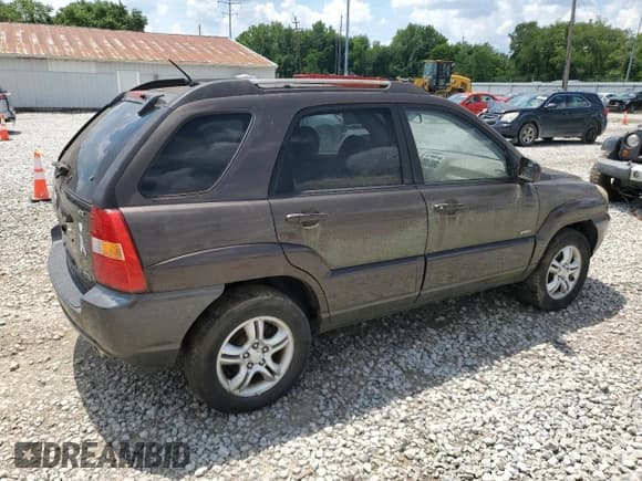 ✅ 2006 Kia Sportage LX • VIN: KNDJE723067239733 • Lot: 63916215. Listed on Copart with 54,964 mi. Free auction sales archive from the USA and detailed vehicle history report at DreamBid. Image 3.