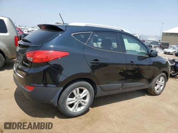 2011 Hyundai Tucson GLS z VIN KM8JUCAC9BU156922, wystawiony jako Copart lot #64274714 z przebiegiem 101 631 mil mil oraz Szkoda całkowita • Salvage title. Historia ofert i sprzedaży dostępna na DreamBid. Obrazek 3.