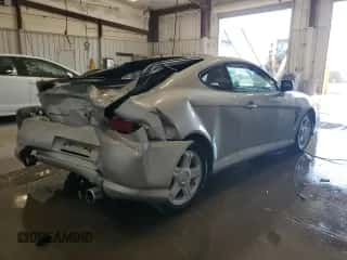 2003 Hyundai Tiburon GT с VIN KMHHN65F53U019155, выставлен на аукционе Copart как лот 67763185 с пробегом 66 114 миль миль и На запчасти • Non repairable. История ставок и продаж доступна на DreamBid. Изображение 3.
