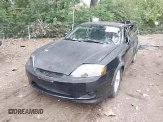 ✅ 2005 Hyundai Tiburon GS • VIN: KMHHM65D65U169098 • Лот: 43287856. Опубликован ранее на IAAI с пробегом 120 000 миль. Бесплатный доступ к архиву аукционных продаж из США и подробный отчёт об истории автомобиля на DreamBid. Изображение 2.