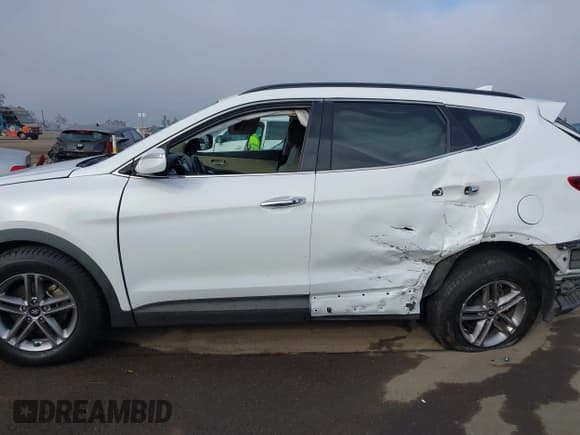 ✅ 2017 Hyundai Santa Fe 2.4L • VIN: 5NMZU3LB3HH034679 • Лот: 43585420. Опубликован ранее на IAAI с пробегом 98 763 миль. Бесплатный доступ к архиву аукционных продаж из США и подробный отчёт об истории автомобиля на DreamBid. Изображение 14.