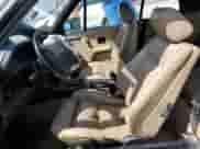 1992 BMW 3 Series z VIN WBABB2310NEC28108, wystawiony jako Copart lot #52196435 z przebiegiem 45 172 mil mil oraz Szkoda całkowita • Salvage title. Historia ofert i sprzedaży dostępna na DreamBid. Obrazek 7.