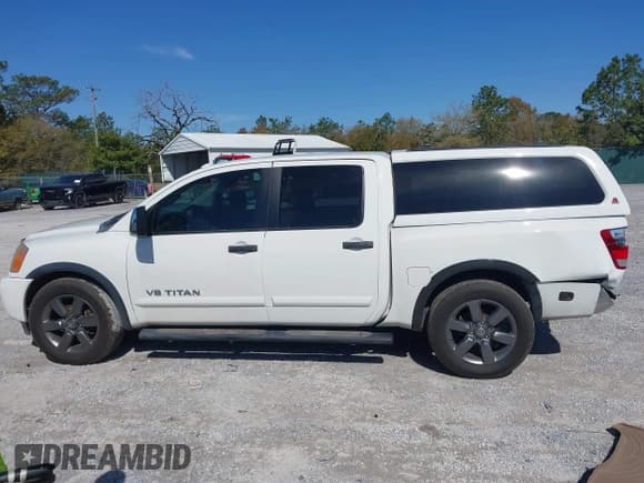 ✅ 2015 Nissan Titan SV • VIN: 1N6BA0ED5FN503033 • Lot: 41881909. Listed on IAAI with 151,432 mi. Free auction sales archive from the USA and detailed vehicle history report at DreamBid. Image 14.