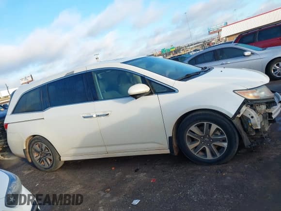 ✅ 2014 Honda Odyssey Touring • VIN: 5FNRL5H94EB129494 • Lot: 43631361. Listed on IAAI with 195,586 mi. Free auction sales archive from the USA and detailed vehicle history report at DreamBid. Image 14.