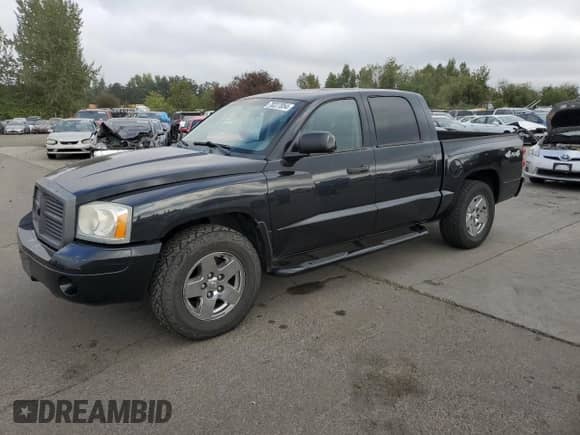 2006 Dodge Dakota SLT z VIN 1D7HW48N56S678965, wystawiony jako Copart lot #70227054 z przebiegiem 159 890 mil mil oraz Szkoda całkowita • Salvage title. Historia ofert i sprzedaży dostępna na DreamBid. Obrazek 1.