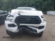 ✅ 2020 Toyota Tacoma SR • VIN: 3TYSX5EN1LT000276 • Lot: 42673254. Listed on IAAI with 57,374 mi. Free auction sales archive from the USA and detailed vehicle history report at DreamBid. Image 12.