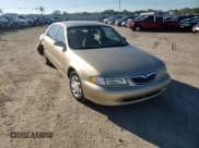 ✅ 1999 Mazda 626 ES • VIN: 1YVGF22C7X5885434 • Lot: 90733295. Wystawiony na Copart z przebiegiem 79 198 mil. Bezpłatny archiwum sprzedaży aukcyjnych z USA i szczegółowy raport historii pojazdu na DreamBid. Zdjęcie 13.