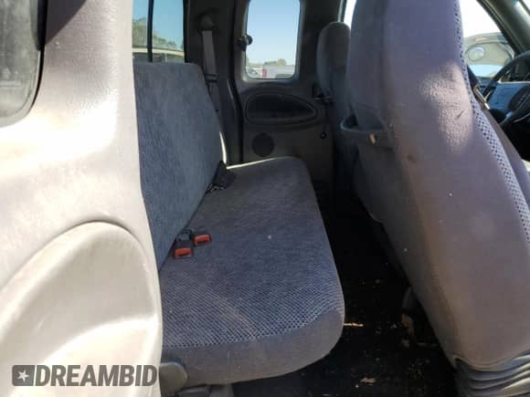 2001 Dodge 1500 z VIN 3B7HC13Y31G199091, wystawiony jako Copart lot #74186904 z przebiegiem 140 674 mil mil oraz Czysty tytuł • Clean title. Historia ofert i sprzedaży dostępna na DreamBid. Obrazek 10.