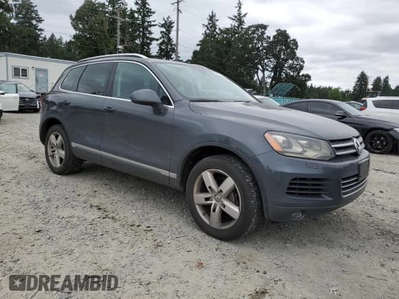 ✅ 2013 Volkswagen Touareg Lux • VIN: WVGEF9BP0DD001551 • Lot: 59818225. Listed on Copart with 171,653 mi. Free auction sales archive from the USA and detailed vehicle history report at DreamBid. Image 4.