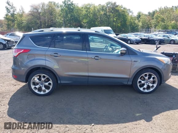 ✅ 2013 Ford Escape Titanium • VIN: 1FMCU9J99DUB51397 • Lot: 43286662. Listed on IAAI with 133,274 mi. Free auction sales archive from the USA and detailed vehicle history report at DreamBid. Image 13.