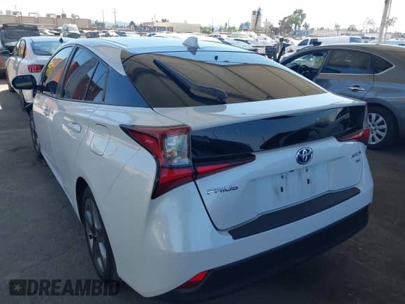 2021 Toyota Prius L Eco with VIN JTDKAMFU4M3134943, listed as a IAAI auction lot 43175713 with 106,611 mi miles and . Bid and sale history available at DreamBid. Image 3.