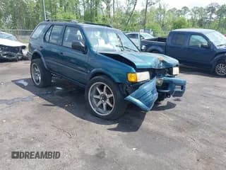 ✅ 1999 Isuzu Rodeo S • VIN: 4S2CK58W6X4332027 • Lot: 42087396. Listed on IAAI with 258,508 mi. Free auction sales archive from the USA and detailed vehicle history report at DreamBid. Image 1.