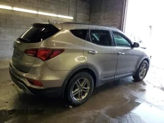 ✅ 2018 Hyundai Santa Fe 2.4L • VIN: 5NMZUDLB5JH069977 • Лот: 38550574. Опубликован ранее на Copart с пробегом 64 463 миль. Бесплатный доступ к архиву аукционных продаж из США и подробный отчёт об истории автомобиля на DreamBid. Изображение 3.