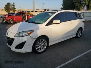 ✅ 2012 Mazda 5 Touring • VIN: JM1CW2CL8C0141965 • Lot: 82707475. Wystawiony na Copart z przebiegiem 148 426 mil. Bezpłatny archiwum sprzedaży aukcyjnych z USA i szczegółowy raport historii pojazdu na DreamBid. Zdjęcie 1.