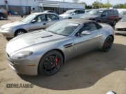 ✅ 2008 Aston Martin Vantage • VIN: SCFBF04B98GD08407 • Лот: 85921475. Опубликован ранее на Copart с пробегом Не указан. Бесплатный доступ к архиву аукционных продаж из США и подробный отчёт об истории автомобиля на DreamBid. Изображение 1.