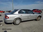 ✅ 2004 Kia Optima LX • VIN: KNAGD126045301139 • Lot: 52876615. Listed on Copart with 165,480 mi. Free auction sales archive from the USA and detailed vehicle history report at DreamBid. Image 3.