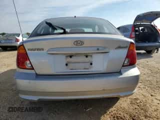 2004 Hyundai Accent GL with VIN KMHCG35C94U292013, listed as a Copart auction lot 84253364 with Not provided miles and Salvage title. Bid and sale history available at DreamBid. Image 6.