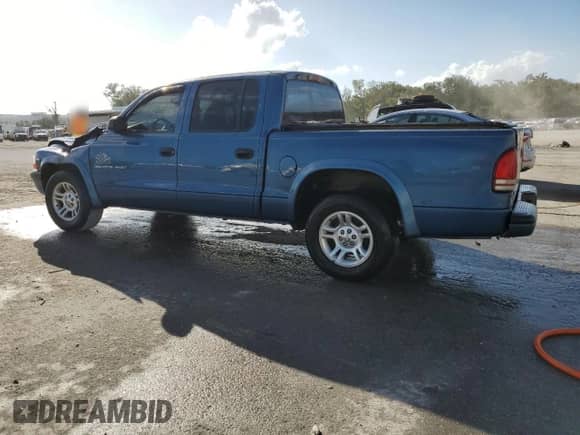 2002 Dodge Dakota Sport с VIN 1B7HL38N72S589857, выставлен на аукционе Copart как лот 77138924 с пробегом 197 117 миль миль и Списание • Salvage title. История ставок и продаж доступна на DreamBid. Изображение 2.