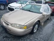 ✅ 1997 Ford Thunderbird LX • VIN: 1FALP6246VH135168 • Lot: 42758066. Listed on IAAI with 148,908 mi. Free auction sales archive from the USA and detailed vehicle history report at DreamBid. Image 2.