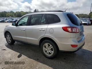 ✅ 2012 Hyundai Santa Fe GLS • VIN: 5XYZGDAB0CG156872 • Lot: 72463214. Listed on Copart with 124,528 mi. Free auction sales archive from the USA and detailed vehicle history report at DreamBid. Image 2.