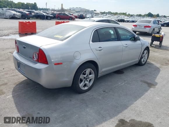 ✅ 2010 Chevrolet Malibu 1FL • VIN: 1G1ZA5E09AF278431 • Lot: 43355679. Listed on IAAI with 165,370 mi. Free auction sales archive from the USA and detailed vehicle history report at DreamBid. Image 4.