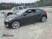 2012 Hyundai Veloster w/Red Int z VIN KMHTC6AD2CU058130, wystawiony jako Copart lot #86747414 z przebiegiem 162 982 mil mil oraz Czysty tytuł • Clean title. Historia ofert i sprzedaży dostępna na DreamBid. Obrazek 1.